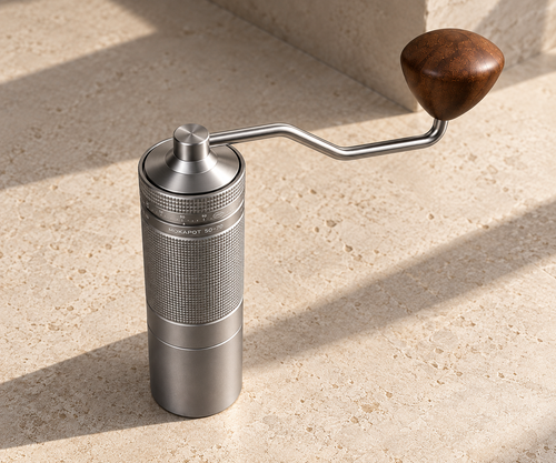 [archive] RITULAR Precision Manual Grinder in Titanium Grey on a travertine surface